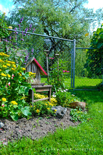 before / How to edge flowerbeds like a pro! via FunkyJunkInteriors.net