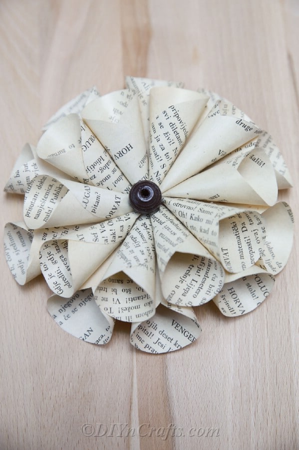 You’ll discover that making paper flowers out of old books is simple.