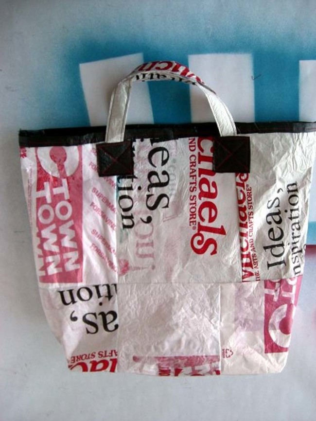 Fashion disposable plastic bags into a reusable tote.