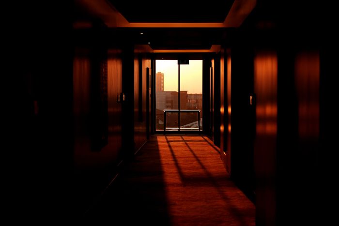 Photo of a hallway with a view from the window in the back