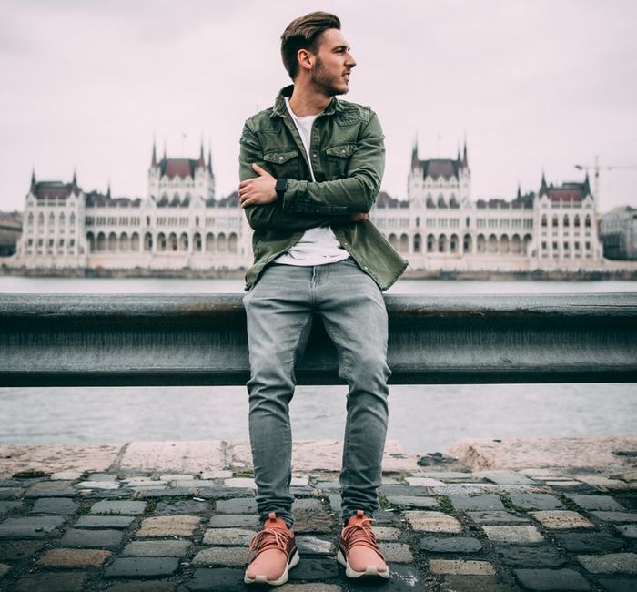 Photo of a guy with the Hungarian Parliament building, background framing
