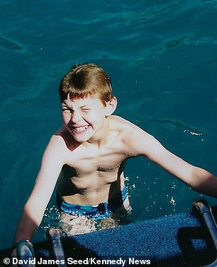 David pictured on holiday as a youngster. He first noticed the dip in his chest when he was around 10-years-old