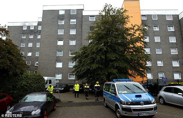 Emergency personnel outside the apartment block in Solingen where five children were found dead in Germany on Thursday