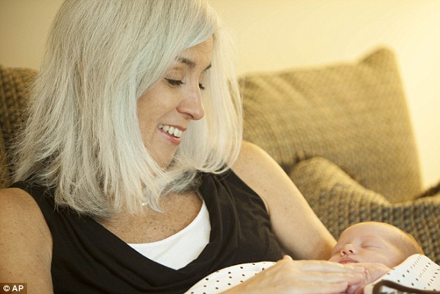 Special bond: Cindy holds her granddaughter Elle Cynthia Jordan less than a week after giving birth to her on August 30
