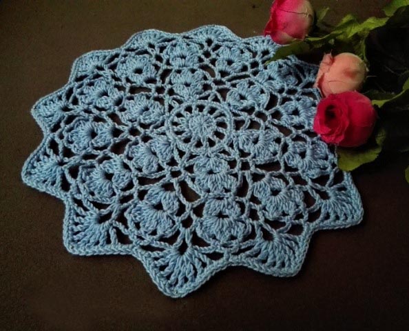 Flower Wheel Doily - Crochet doily patterns are unique and a great investment of time. They take skill and attention to detail and are perfect for relaxing. #crochetpatterns #crochetdoilypatterns #freecrochetpatterns #crochetaddict