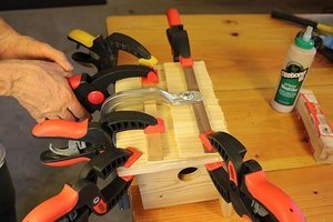 Use clamps to hold the shims in place until the glue dries.