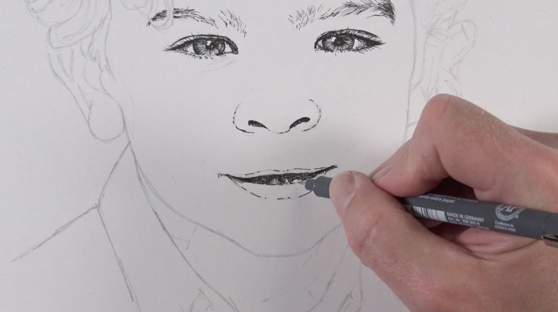 Drawing facial features with pen and ink