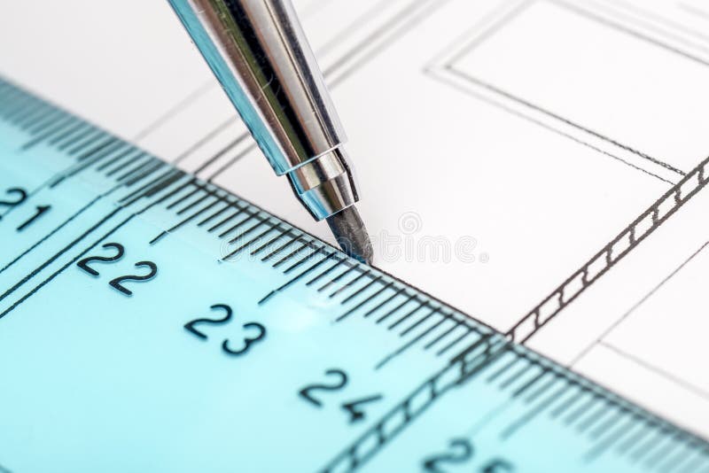 Architect Drawing Plans. An Architect Drawing A House Plan With The Help Of His Tools: Pencil and Ruler stock photos