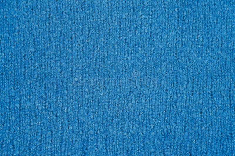 Blue knitted texture. Handmade Knitwear. Background. Abstract stock images