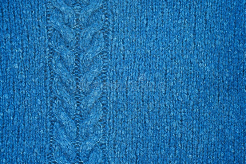 Blue knitted texture with a relief pattern. Handmade Knitwear. Background, abstract stock images