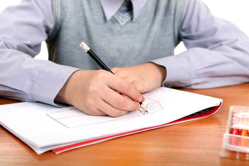 Boy is Drawing. Kid Drawing at the School Desk Closeup stock photos