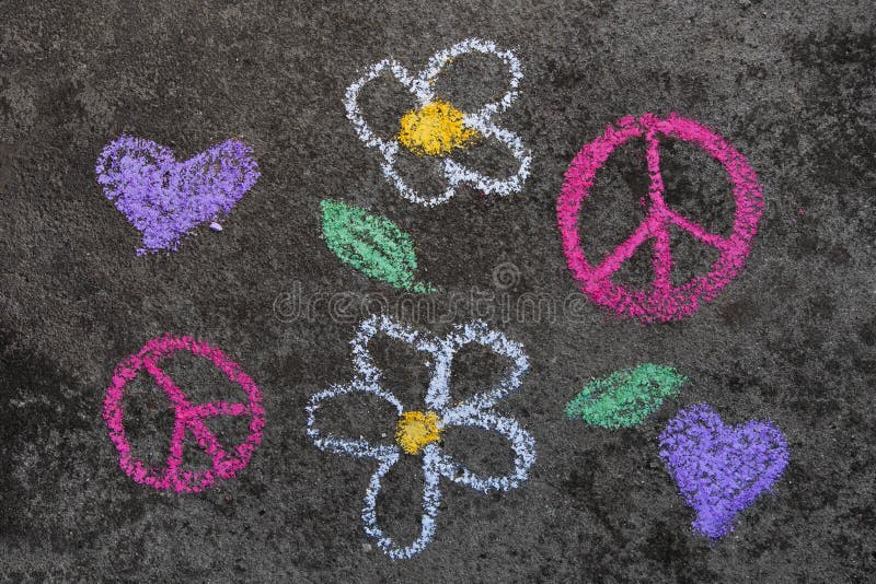 Chalk drawing: Pink peace symbol and beautiful flowers. Colorful chalk drawing on sidewalk: Pink peace symbol and beautiful flowers stock photography