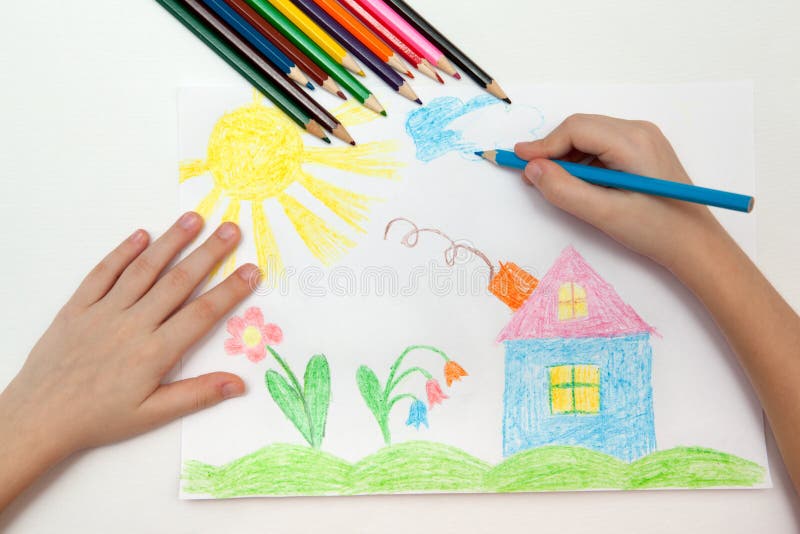 Childrens drawing. Child draws a pencil drawing of the world royalty free stock images