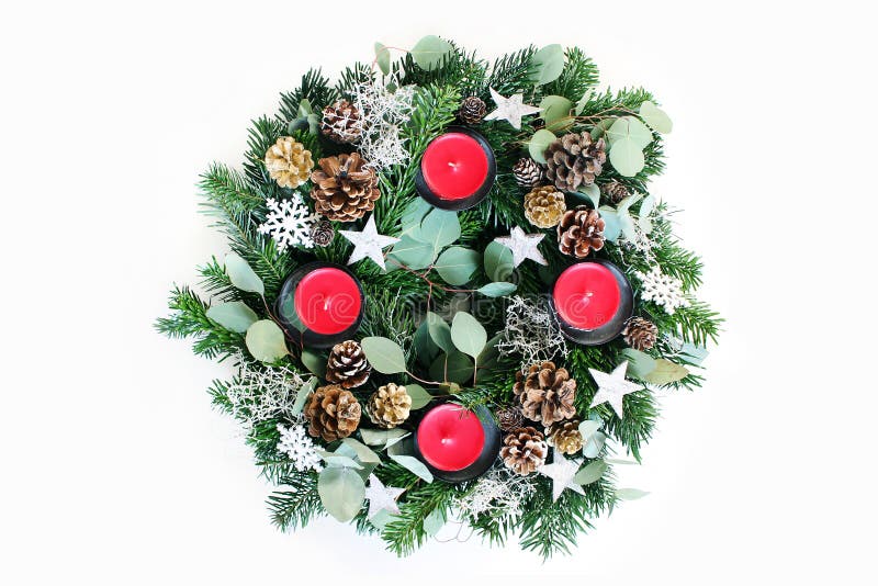 Christmas advent wreath isolated on white table background. Decorated by evergreen fir tree branches, eucalyptus leaves royalty free stock photos