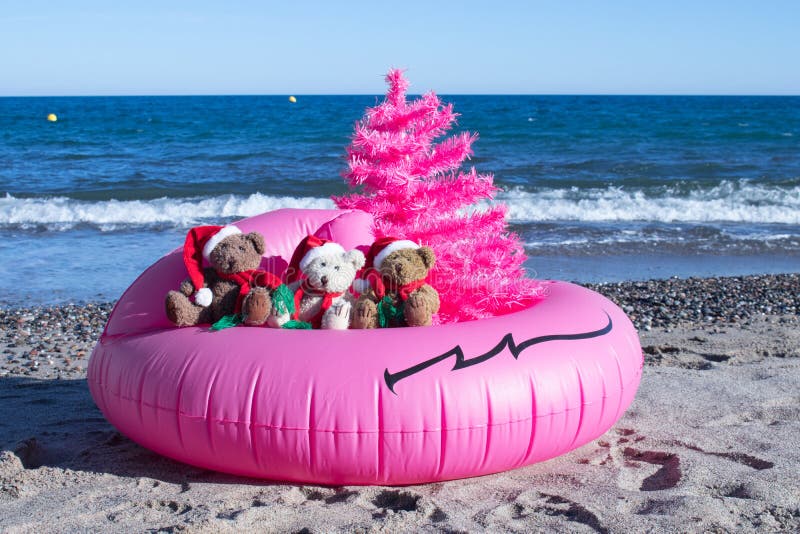Christmas Holiday Is Coming. Happy Holidays Postcard Design. Unusual Christmas Design Concept. Christmas Holiday Is Coming. Santa Bears in a pink buoy with a royalty free stock photo