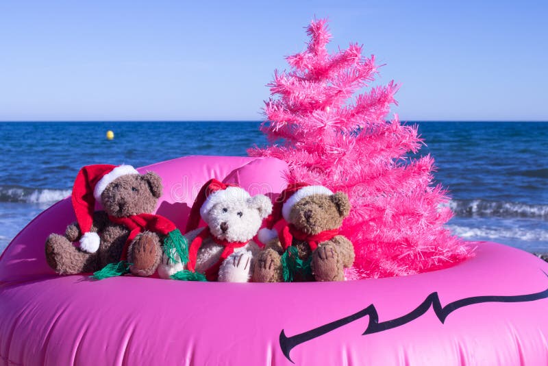 Christmas Holiday Is Coming. Happy Holidays Postcard Design. Unusual Christmas Design Concept. Christmas Holiday Is Coming. Santa Bears in a pink buoy with a royalty free stock photos