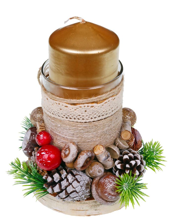 Christmas homemade candlestick with golden candle  in rustic style made of pines cones red berries and berries  isolated macro royalty free stock photography