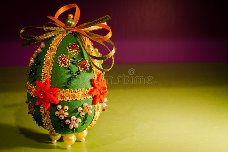 Cloth Easter egg. Picture of an handmade cloth Easter egg with beads and bijoux stock images