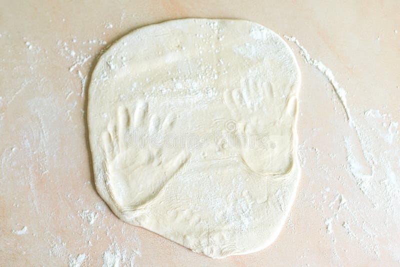 Dough with handprints royalty free stock image