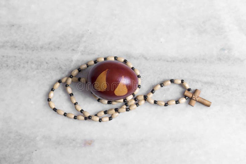 Easter egg and Rosary Beads royalty free stock photo