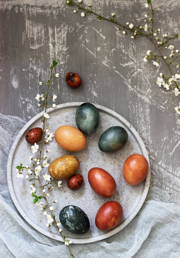 Easter eggs dyed with natural dyes, cabbage, chamomile, hibiscus and onion peel. Selective focus royalty free stock images