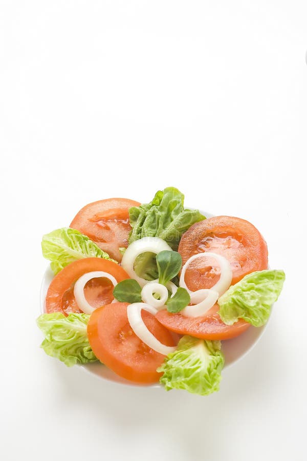Fresh natural salad bowl tomato lettuce onion. Oil vinegar stock photo