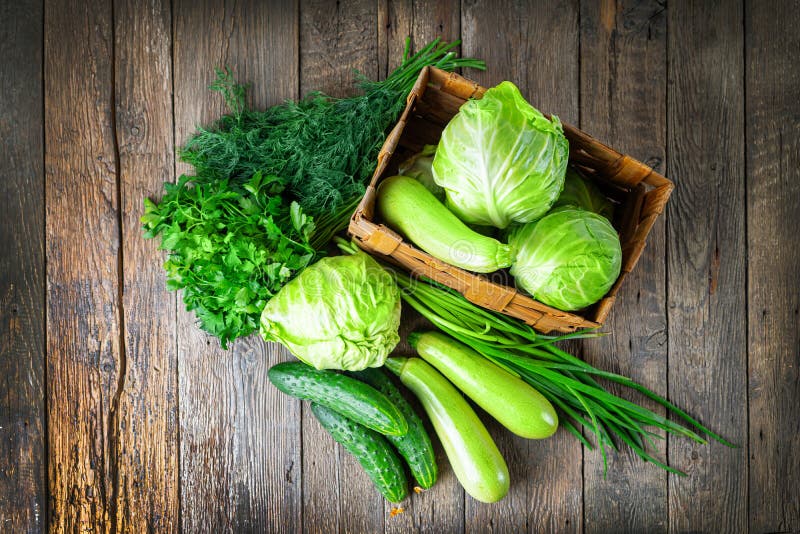 Green food. Composition with natural green vegetables. Cabbage, squash, dill, parsley and green onion. Green food. Composition with natural green vegetables royalty free stock image