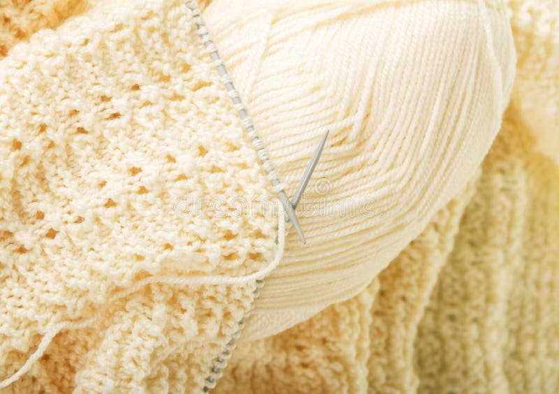 Handmade knitwear, yarn and knitting needles. Background. Close-up stock images
