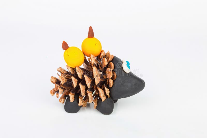 Hedgehog from pine cone and plasticine. Stock image macro royalty free stock images