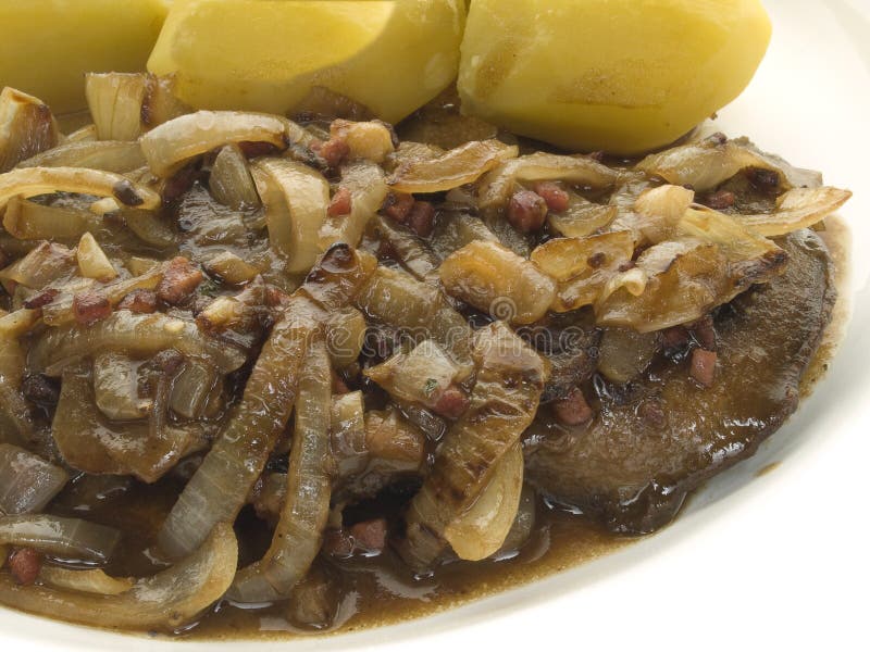 Liver with onions. Fried beef liver with onions and potatoes stock image