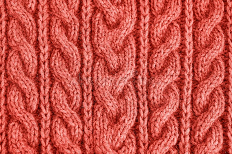 Living Coral knitted texture. Handmade Knitwear. Background. Color of the year 2019 concept. Living Coral knitted texture. Knitwear handmade. Abstract stock photo