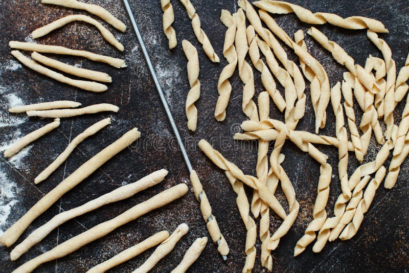 Making whole wheat flour pasta fusilli al ferro stock photo