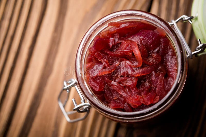 Natural diy red onion marmalade. Homemade DIY natural healthy red onion marmalade with rasberry sirup stock photos