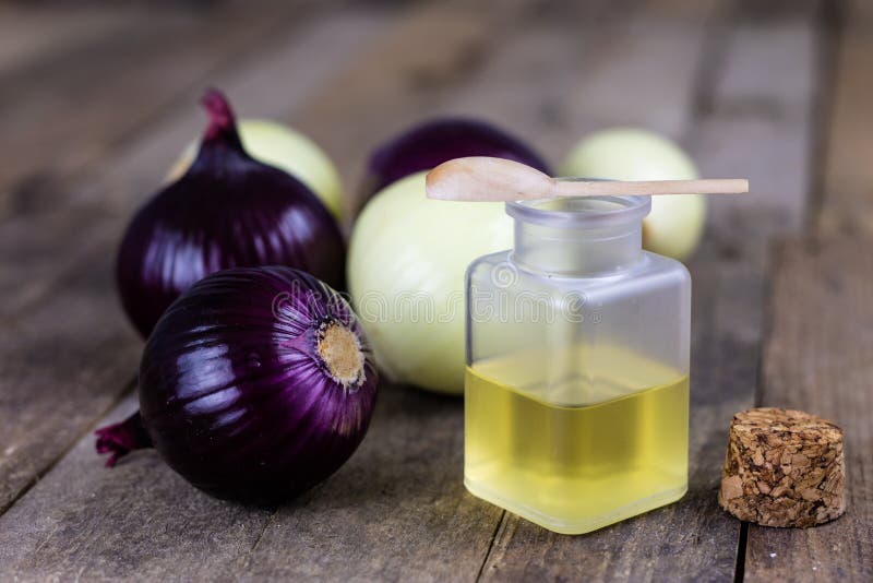 Onion and medicinal juice for a cold. Natural and alternative me. Thods of treatment. Light background royalty free stock image