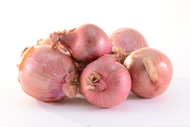 Onions. Stack of onions isolated on white background stock photography