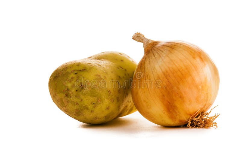 Onions and potatoes. Potatoes and onions were photographed in studio on a white background royalty free stock photography