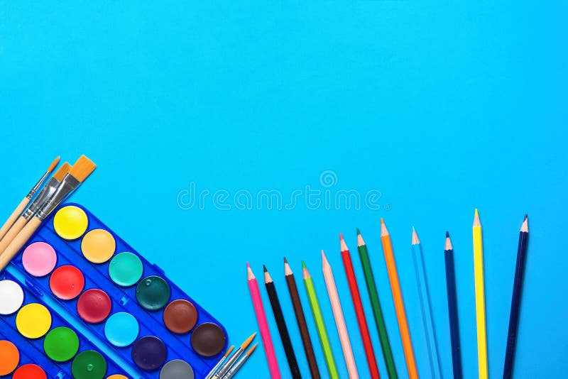 Palette with Rows of Multicolored Watercolor Paints Brushes Pencils on Blue Background. Arts School Class Creativity Painting. Hobbies Kids Education Concept royalty free stock images