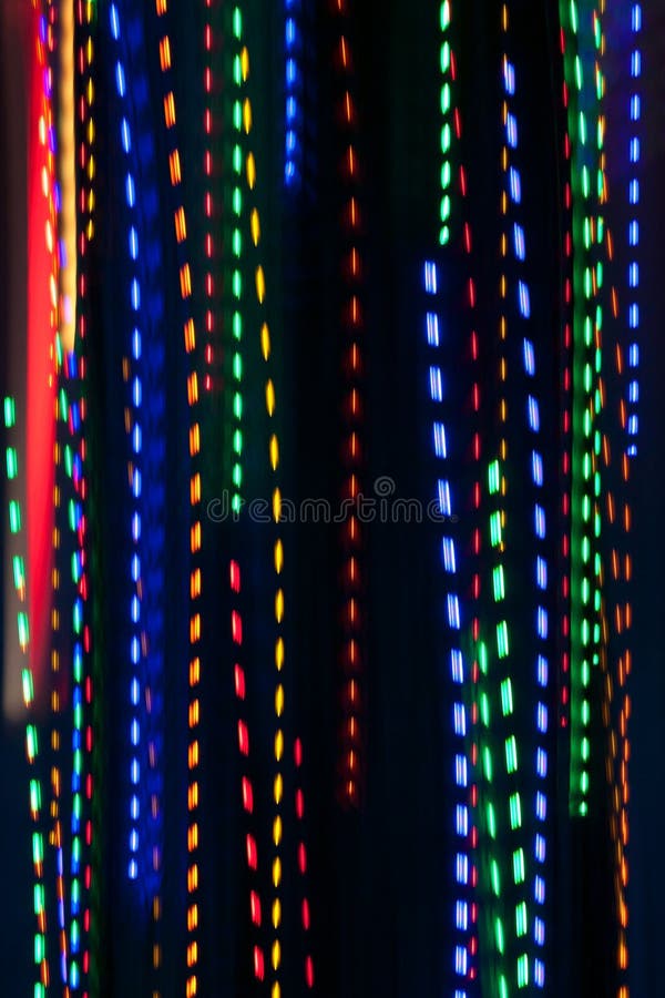 Pan Of Colorful Holiday Lights Creates Electric Rain Pattern royalty free stock image