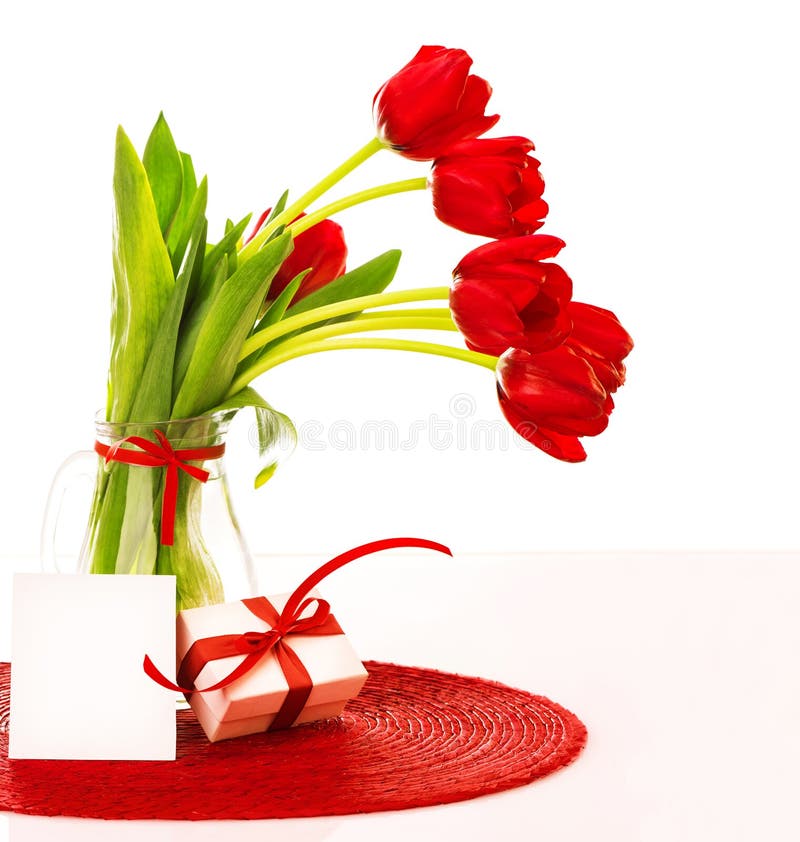 Red tulips bouquet with gift royalty free stock image