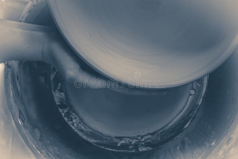 Photo in old vintage style. Master Potter holds round clay plate stock images