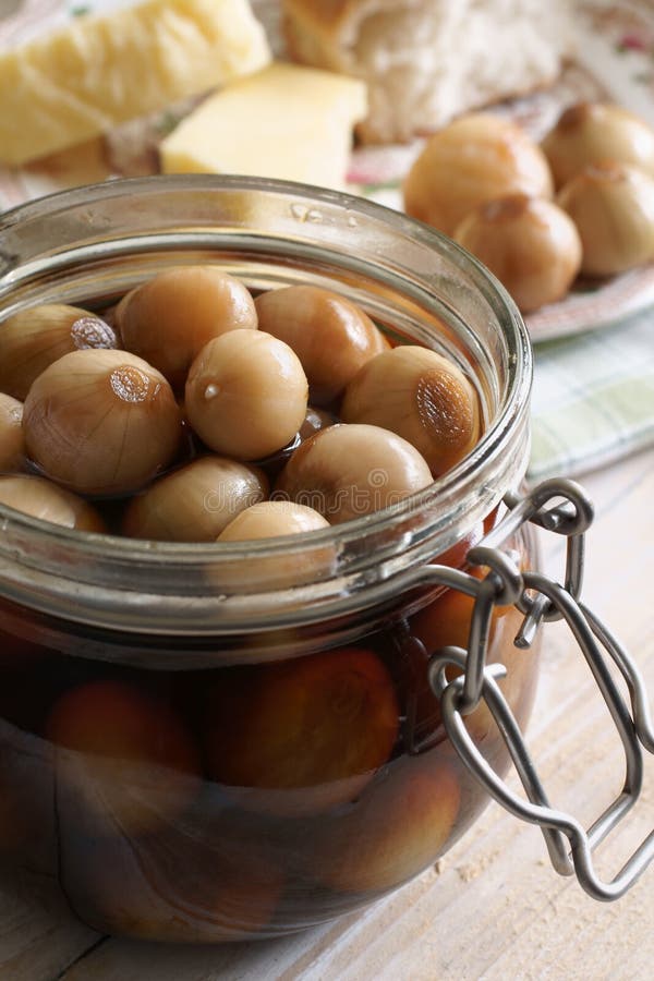 Pickled Onions. Home made pickled onions served with bread and cheese royalty free stock photo