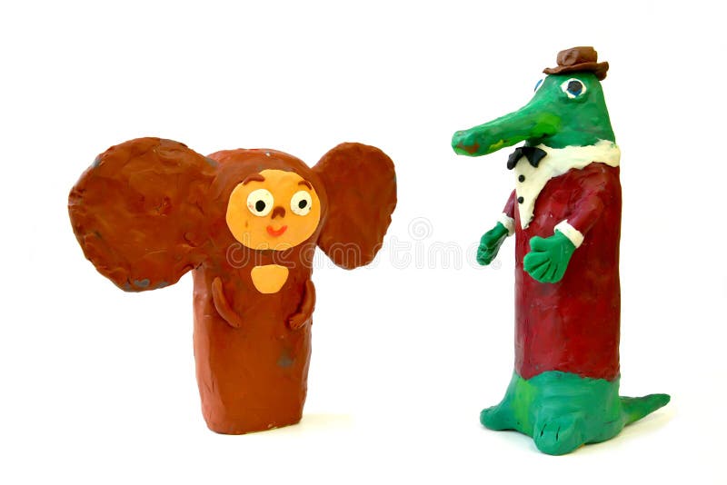 Plasticine figures the Cheburashka and Gena`s Crocodile on a white background. Children`s creativity royalty free stock photos