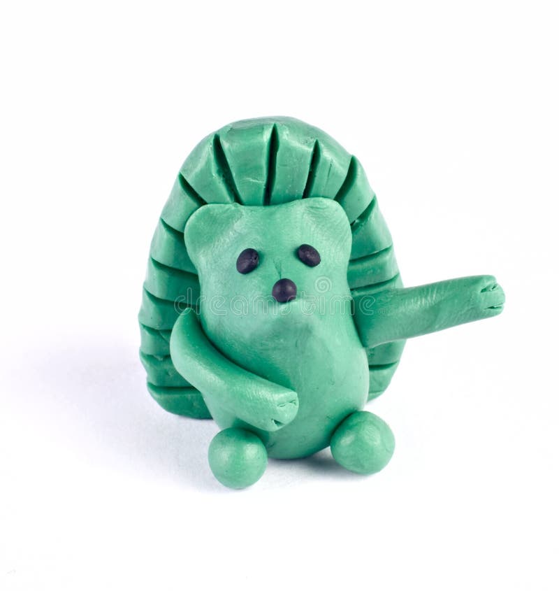 Plasticine hedgehog. There is plasticine hedgehog isolated over white royalty free stock image