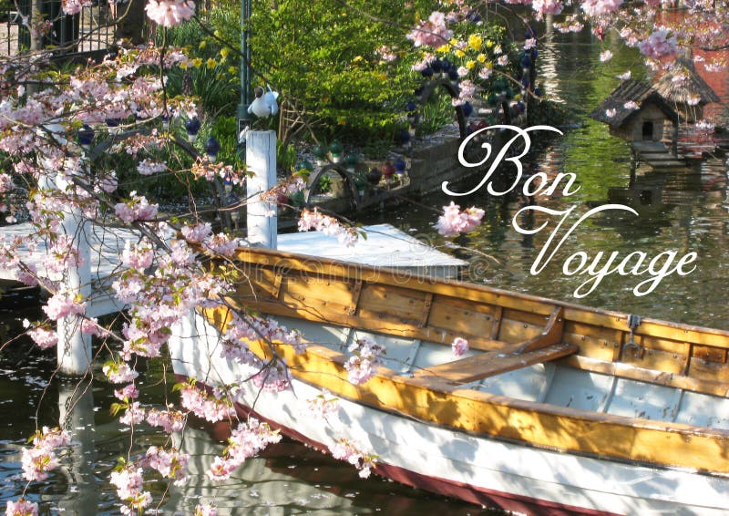 Postcard with a beautifully view of a wooden boat in Copenhagen in Denmark surrounded by a sea of ​​flowers in a small lake. Postcard with a beautifully view royalty free stock photography