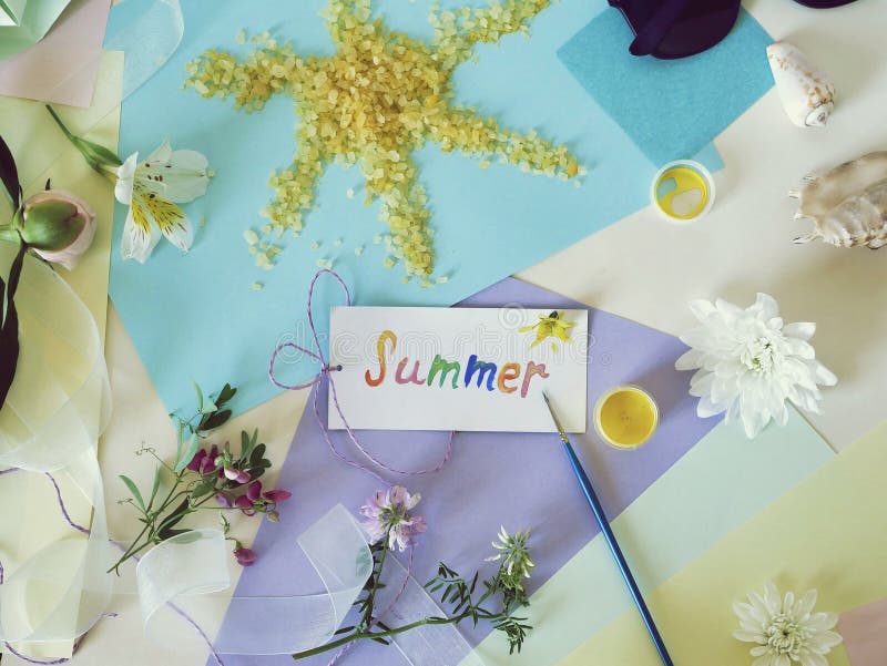 Postcard summer, the sun from sea salt, fresh flowers, colored paper, brushes - the concept of congratulations on the summe. R, seasonal decorative composition royalty free stock photography