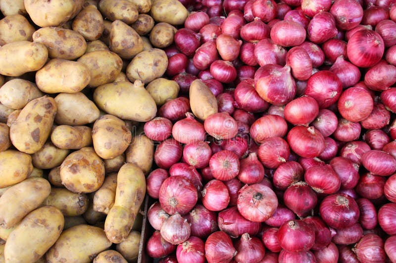 Potatos and onions. Vegetables marketplace in small town - potatos and red onions stock photo