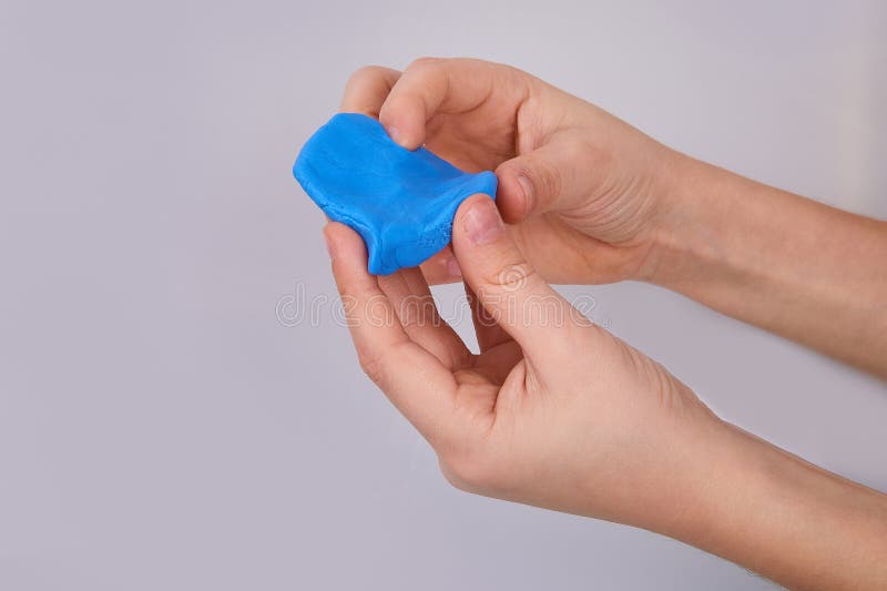The process of play dough modeling, the child`s hands sculpt figures. stock image