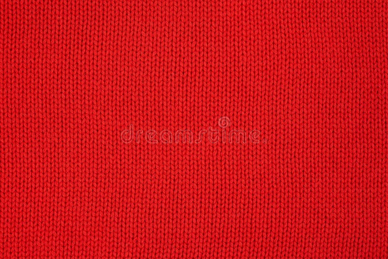 Red knitted texture. Handmade Knitwear. Background. Abstract stock photo