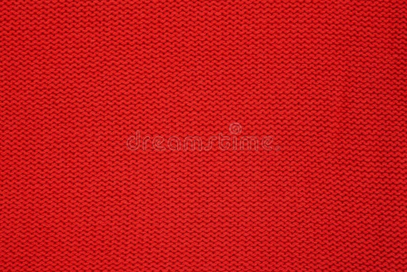 Red knitted texture. Handmade Knitwear. Background. Red knitted texture. Handmade Knitwear, reverse stitch. Background stock images