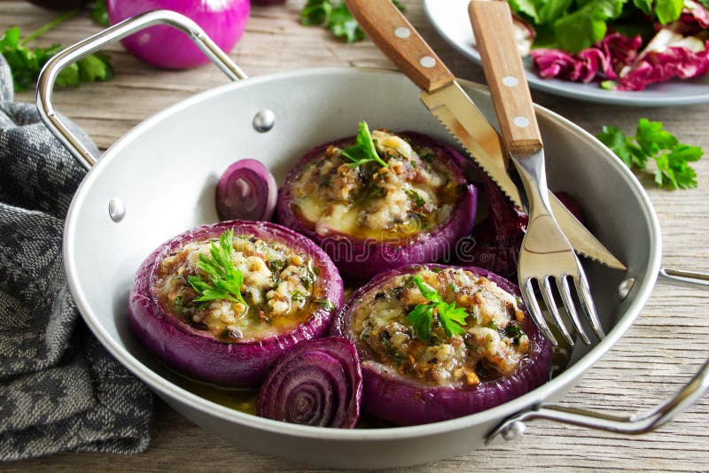 Red onions stuffed with goat cheese. And bacon stock images